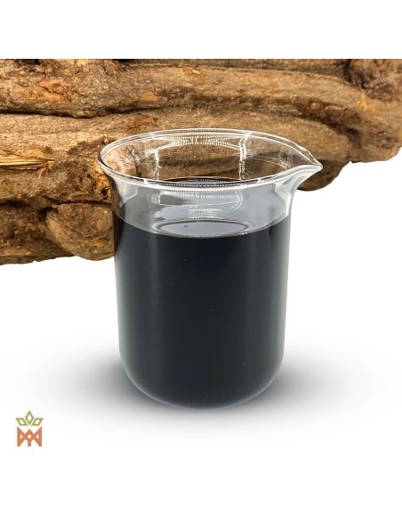 Caapi rouge du Pérou – Extrait liquide 12:1, Banisteriopsis caapi – bécher d’extrait foncé contre un tronçon de liane