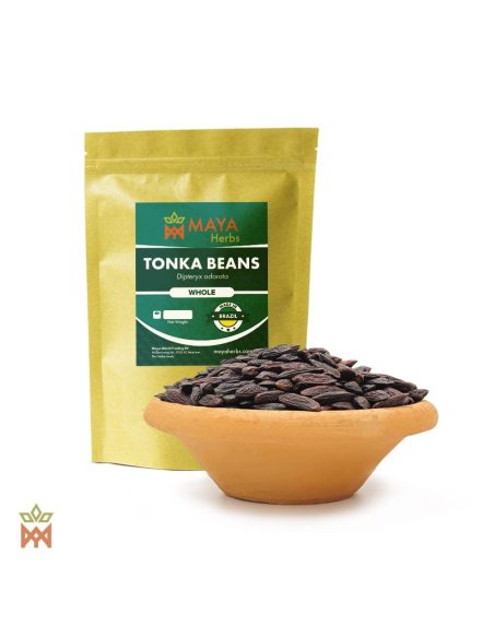 Fèves tonka – sachet Maya Herbs et graines entières de Dipteryx odorata dans un bol en terre cuite